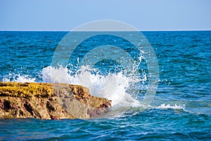 Rock and waves in sea