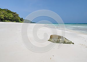 Rock on white sand beach of Tachai island, Thailand