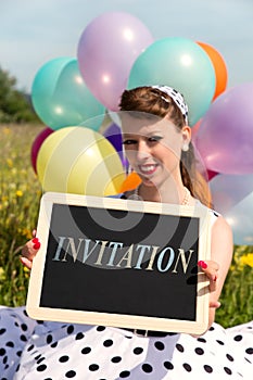 Rockabilly Girl holding a board with word invitation, concept Party