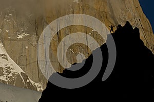 Rockclimber facing granite wall of fitz roy peak
