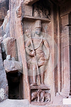 Rockcut Sculpture of Shiva Guardian Wielding Shiva\'s Trident, Cave-1 Badami Cave Temples, Badami, Bagalkot, Karnataka, India photo