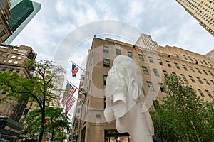 Rockefeller Plaza, Picture of Frieze Sculpture. Jaume Plensa - Behind the Walls.  Midtown of Manhattan