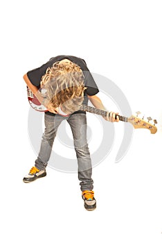 Rocker boy playing bass guitar