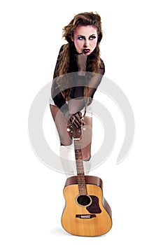 Rocker girl with acoustic guitar