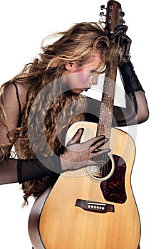 Rocker girl with acoustic guitar