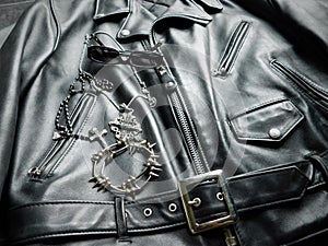 Rocker outfit, leather jacket, jewelry and sunglasses