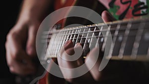 Rocker playing guitar chord notes