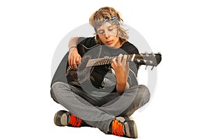 Rocker teen with acoustic guitar