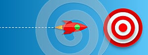 The rocket approaches the target on a blue background, focused on success Ã¢â¬â vector photo