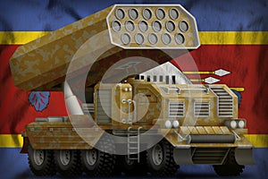 Rocket artillery, missile launcher with sand camouflage on the Swaziland national flag background. 3d Illustration