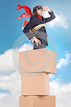 Rocket businessman in a cardboard box