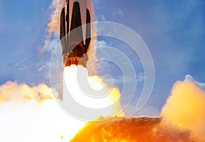 Rocket launch against blue sky