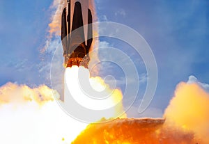 Rocket launch against blue sky photo