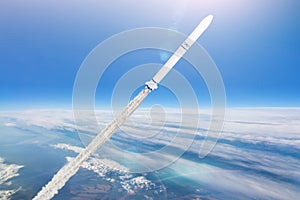 Rocket launch. Flying a spaceship above the clouds in the atmosphere of the Earth