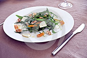 Rocket salad with walnuts, pear and bottarga