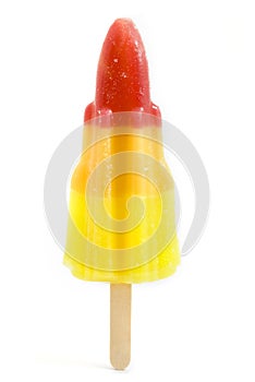 Rocket shaped ice lolly over white