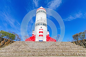 Rocket-shaped symbol tower with blue sky background in Inariyam