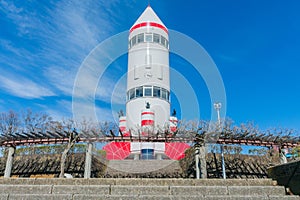 Rocket-shaped symbol tower with blue sky background in Inariyam