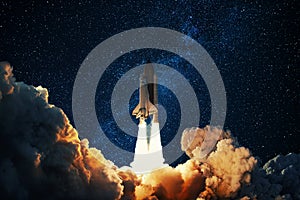 Rocket takes off in the starry sky. Spaceship begins the mission. Space shuttle taking off on a Planet Mars photo