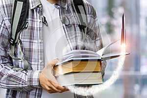 Rocket takes off from the textbook of a student.