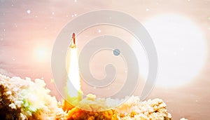 Rockets launch into space on the starry sky. spacecraft flies into space with clouds of smoke. Elements of this image furnished by