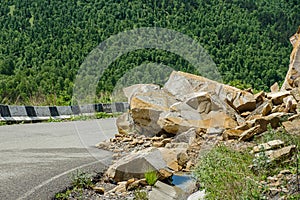 Rockfall on the road in the mountains.