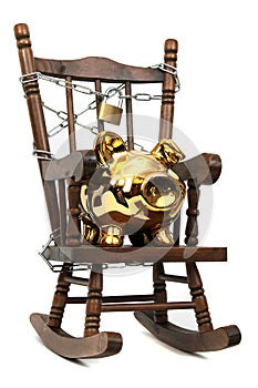 Rocking chair and piggy bank captured with chain a