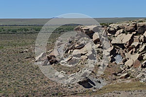 Rockpile ledge of Petrified National Forest desert floor Panorama