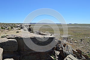 Rockpile ledge of Petrified National Forest desert floor Panorama