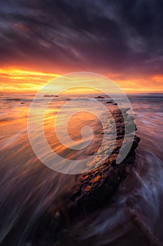 Rocks in Barrika beach at sunset