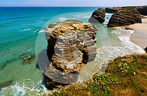 Rocks at beach in summer day. Cantabric coast of Spain