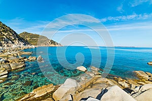 Rocks and blue sea in Punta Molentis