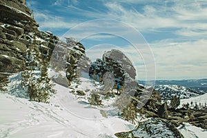 On the rocks in the blue sky