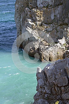 Rocks in blue water of Black sea.