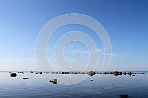 Rocks on calm waters