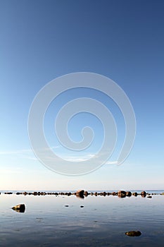 Rocks on calm waters