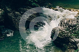 Rocks cascade creek, mountain river