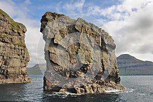 Rocks and caves of the coast on Vágar Island