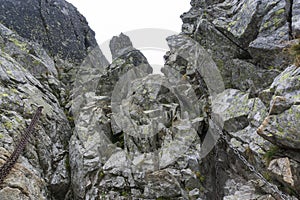 Rocks and chains on the Bystra lavka pass. High Tatras. Slovakia