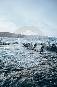 Rocks and cliffs on the beach in Playa de los Muertos, Spain