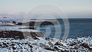 Rocks and cliffs on the shore of the Atlantic Ocean in Iceland