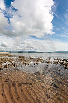 Rocks and Cloud formation over  Llanddwyn island, Anglesey, Gwynedd, Wales, United Kingdom