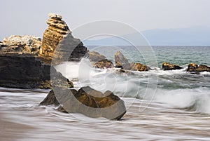 Rocks on coast of Aegean sea (Greece) photo