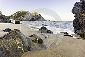 Rocks on coastline of Atlantic ocean on sandy Adraga beach