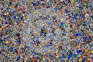 Rocks and colorful glass recycled as ground cover.