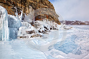 Rocks covered by ice on winter siberian Baikail lake