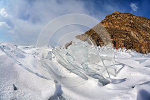 Rocks covered by ice on winter siberian Baikail lake