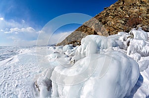 Rocks covered by ice on winter siberian Baikail lake