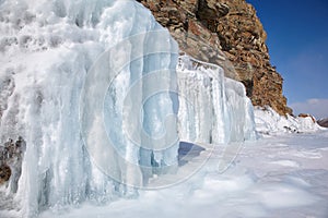 Rocks covered by ice on winter siberian Baikail lake