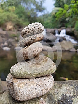 Rocks creativity and the blurred waterfall